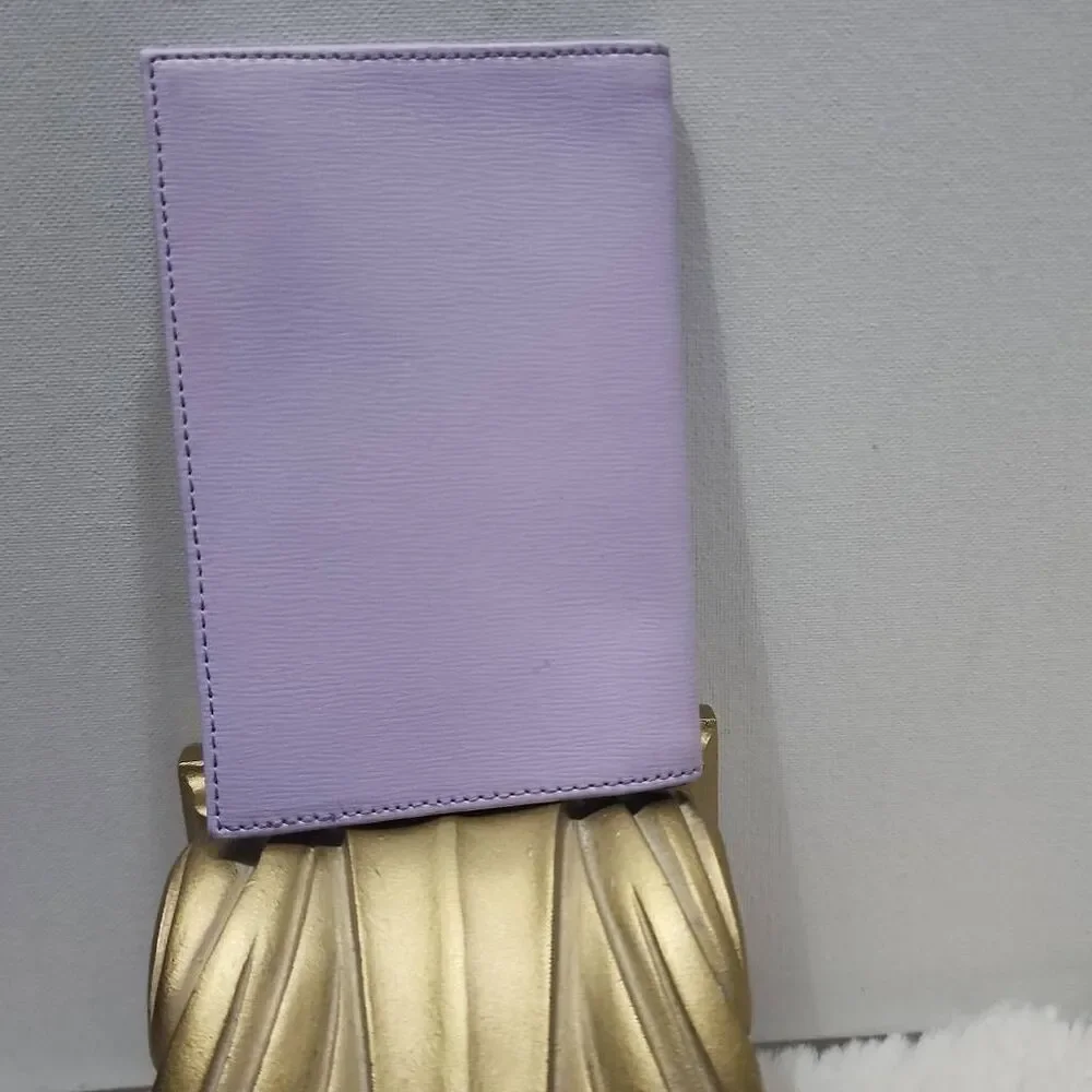 Ted Baker leather passport holder features rose gold foil branding.